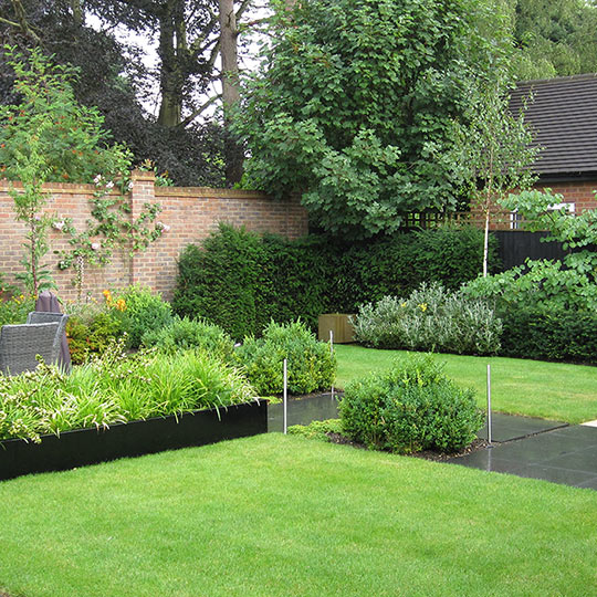 Modern garden with raised planters, Bushey